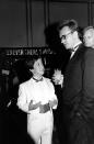 FILE - British pop singer Sting, right, talks with Sean Lennon prior to the Broadcast Music, Inc. (BMI) Pop Awards in Beverly Hills, Calif., on June 19, 1985. An album, "Gimme Some Truth" by John Lennon, will be released Friday, on what would have been his 80th birthday. (AP Photo/Nick Ut)