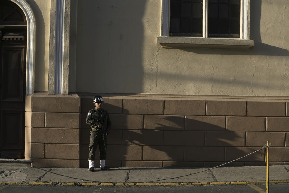 A military police officer stands guard outside the National Palace in preparation for the arrival of Taiwan's President Tsai Ing-wen, in Guatemala City, Friday, March 31, 2023. Tsai is in Guatemala for a three-day official visit. (AP Photo/Moises Castillo)