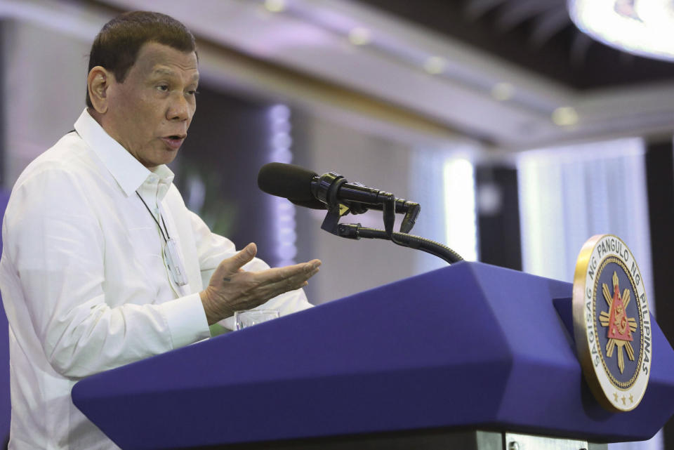 FILE - In this Feb. 10, 2020, file photo provided by the Malacanang Presidential Photographers Division, Philippine President Rodrigo Duterte delivers a speech during the 11th Biennial National Convention and 22nd founding anniversary of the Chinese Filipino Business Club, Inc. in Manila, Philippines. The Philippines notified the United States of its intent to terminate a major security pact allowing American forces to train in the country in the most serious threat to the countries'f treaty alliance under President Rodrigo Duterte. (Toto Lozano/Malacanang Presidential Photographers Division via AP, File)