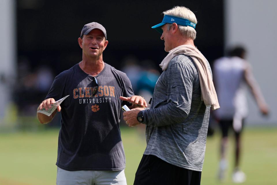 Clemson coach Dabo Swinney talks with Jaguars coach Doug Pederson upon his visit tot he Jags training camp on Aug. 1. Swinney coached Jaguars quarterback Trevor Lawrence, running back Travis Etienne and guard Tyler Shatley.