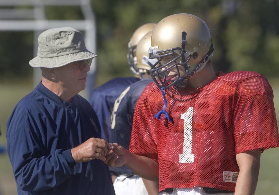 New Eqypt football coach Al Saner, 76, of Pt. Pleasant, talks with starting quarterback Dylan Rowley during practise . Peter Ackerman / Asbury Park Press - New Egypt - 9/18/07