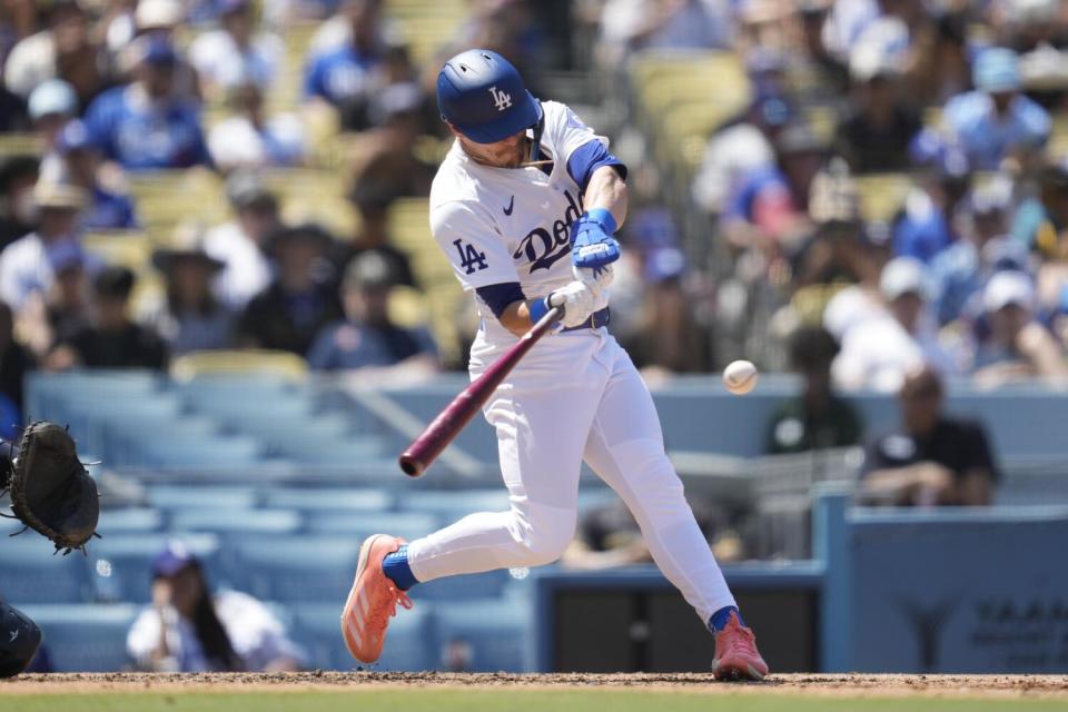 Kiké Hernández hits a homerun in the fifth inning for the Dodgers on Sunday.