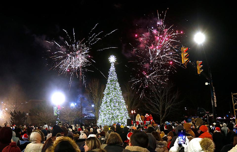 Fireworks burst in the sky behind the community Christmas tree in Corner Park on Saturday, Dec. 3, 2022. TOM E. PUSKAR/ASHLAND TIMES-GAZETTE