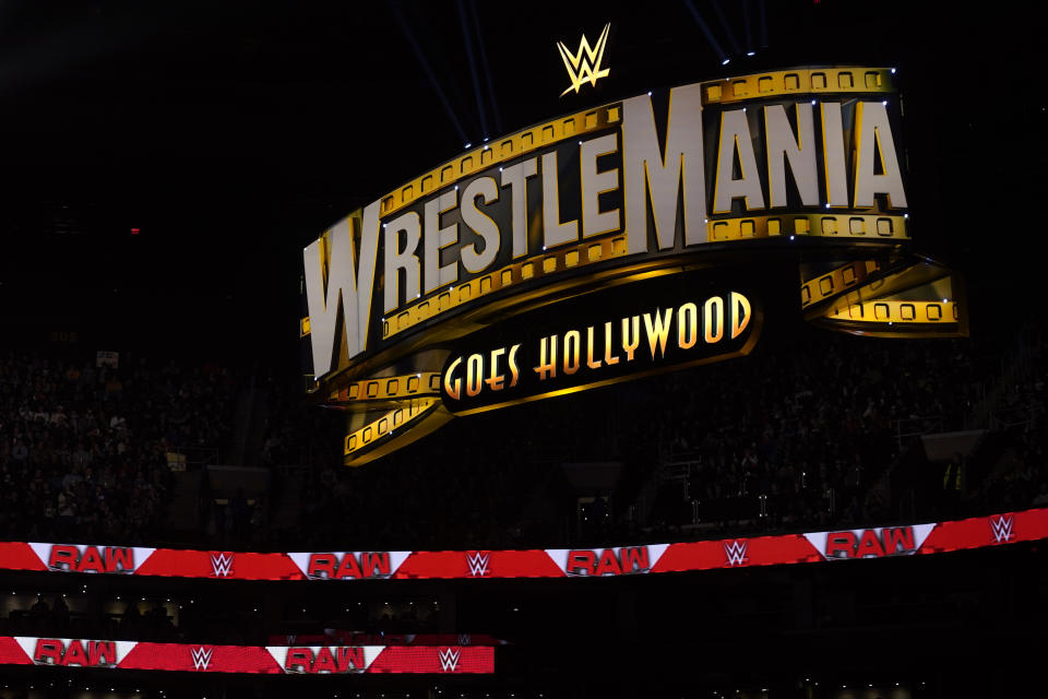FILE - A WrestleMania sign hangs over the crowd during the WWE Monday Night RAW event, Monday, March 6, 2023, in Boston. WWE's sponsorship revenue for SummerSlam, Saturday, Aug. 5, 2023, rose 23% from a year ago to $7 million, the most for any event outside of WrestleMania. (AP Photo/Charles Krupa, FIle)