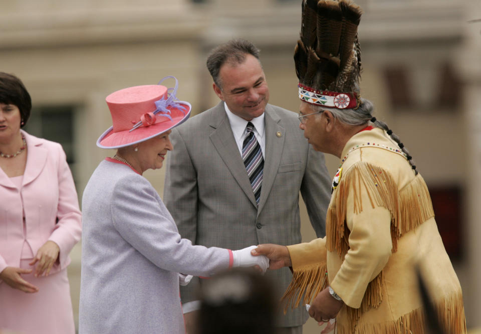 <p>Queen Elizabeth II and Tim Kaine meet Native Americans at the state Capitol on the first day of her U.S. tour, May 3, 2007, in Richmond, Va. (Photo: Susan Walsh/AP)</p>