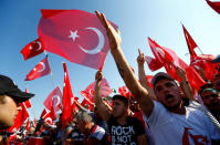 <p>People wave Turkey’s national flags as they arrive to attend a ceremony marking the first anniversary of the attempted coup at the Bosphorus Bridge in Istanbul, Turkey, July 15, 2017. (Photo: Murad Sezer/Reuters) </p>