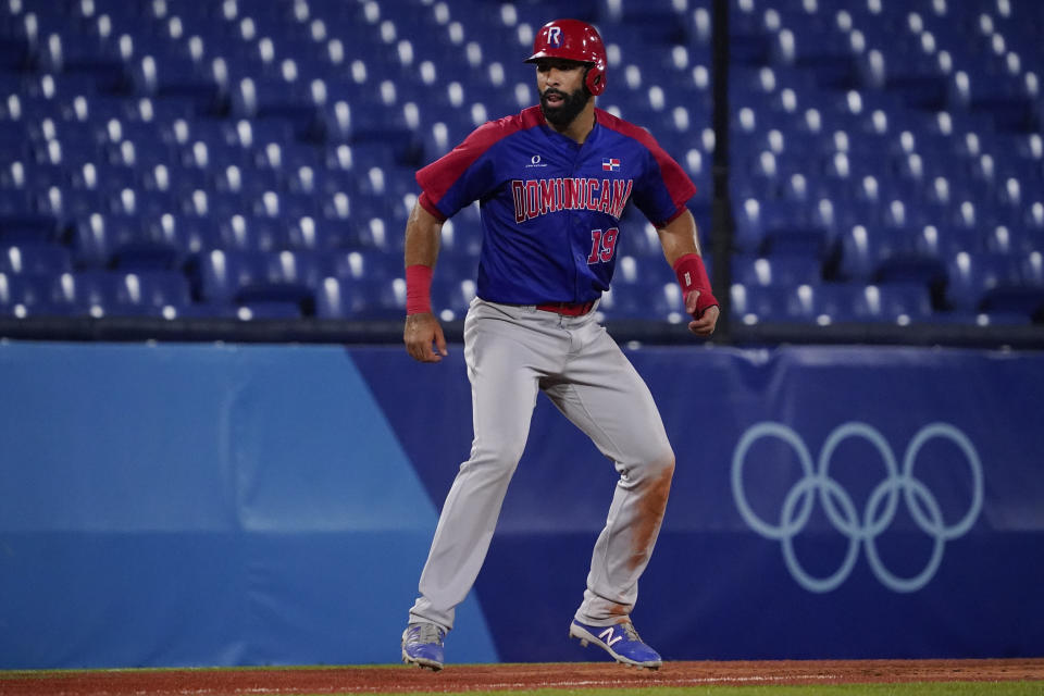 Dominican Republic's Jose Bautista lead off third base during a baseball game against South Korea at the 2020 Summer Olympics, Sunday, Aug. 1, 2021, in Yokohama, Japan. (AP Photo/Sue Ogrocki)