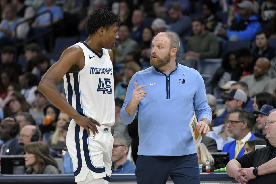 Memphis Grizzlies head coach Taylor Jenkins talks with forward GG Jackson (45) in the second half of an NBA basketball game against the Cleveland Cavaliers, Thursday, Feb. 1, 2024, in Memphis, Tenn. (AP Photo/Brandon Dill)