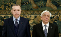 Greek President Prokopis Pavlopoulos and Turkish President Tayyip Erdogan attend a state dinner at the Presidential Palace in Athens, Greece, December 7, 2017. REUTERS/Costas Baltas