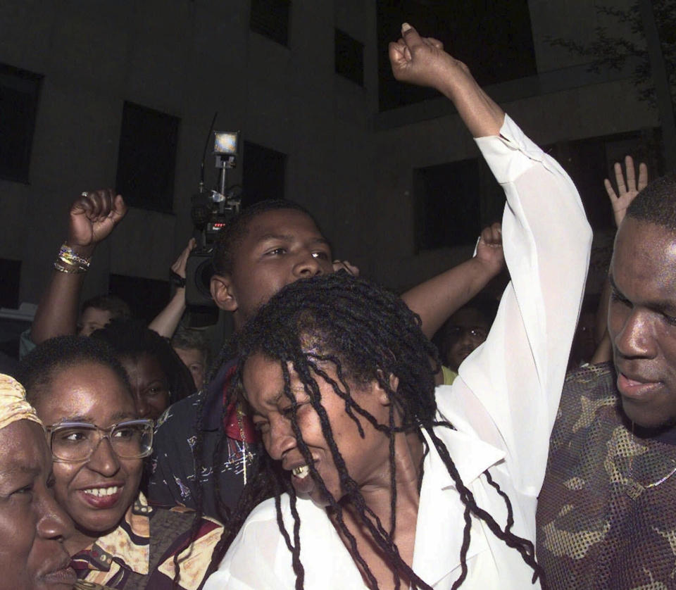 FILE - Betty Tyson raises her arm in celebration as she is released at the Public Safety Building, Wednesday, May 27, 1998, in Rochester, N.Y. Tyson, who spent 25 years in prison for murder before being exonerated will be laid to rest Friday. She was 75. (Shawn Dowd/Democrat and Chronicle via AP, File)