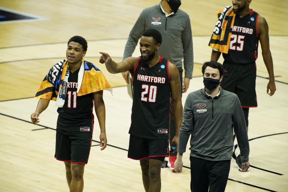 Hartford Hawks guard PJ Henry (11) and guard Austin Williams (20) walk off the court after the Baylor Bears beat the Hartford Hawks in the first round of the 2021 NCAA Tournament