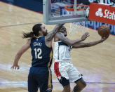 Washington Wizards guard Bradley Beal (3) shoots past New Orleans Pelicans center Steven Adams (12) in the first quarter of an NBA basketball game in New Orleans, Wednesday, Jan. 27, 2021. (AP Photo/Derick Hingle)