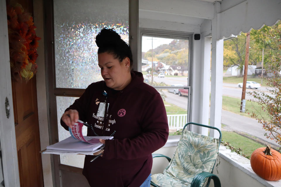 Sheena Griffith, a recovery coach and independent candidate for city council, canvasses in a Charleston, W.Va., neighborhood, Tuesday, Oct. 18, 2022. (AP Photo/Leah Willingham)