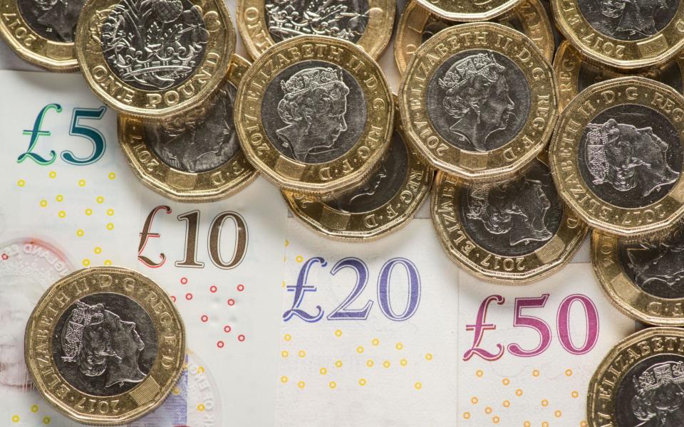 At present just over a third of payments made in the UK are cash but this is set to plunge in the coming years - PA