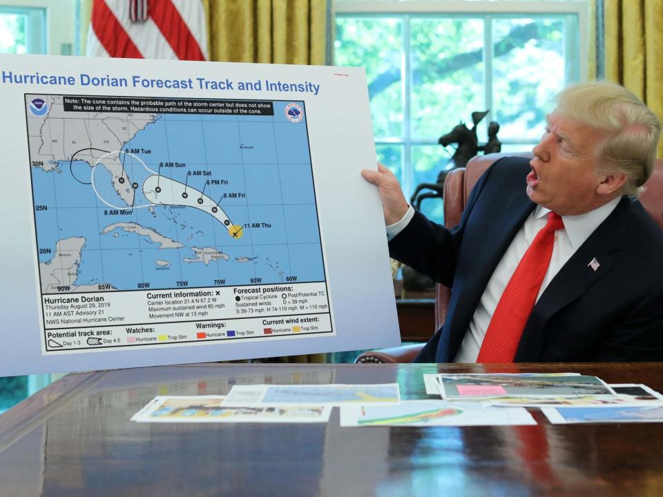 US president Donald Trump holds a chart showing the projected track of Hurricane Dorian which appears to have been altered (REUTERS/Jonathan Ernst)