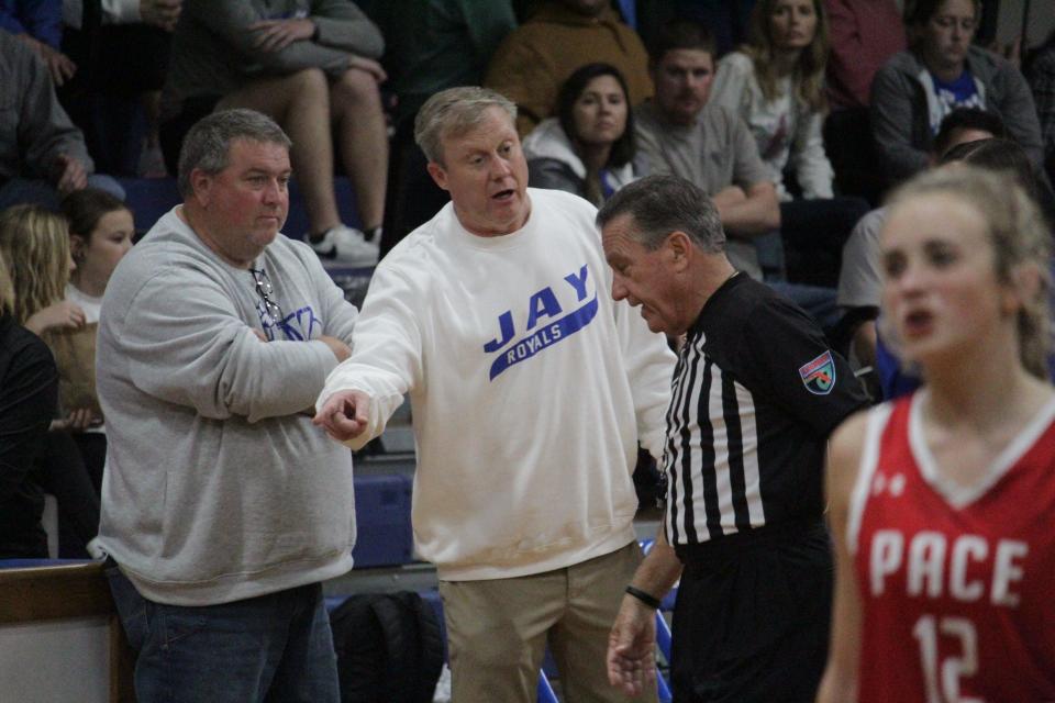 Jay girls basketball head coach Jorey Diamond (white sweater) tries to get some clarification from an official during the Royals' 45-32 victory over Pace on Thursday, Dec. 14, 2023, in Jay.