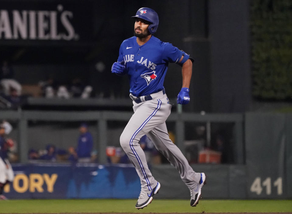 Toronto Blue Jays' Marcus Semien rounds the bases on his solo home run off Minnesota Twins pitcher Bailey Ober in the sixth inning of a baseball game, Friday, Sept. 24, 2021, in Minneapolis. (AP Photo/Jim Mone)
