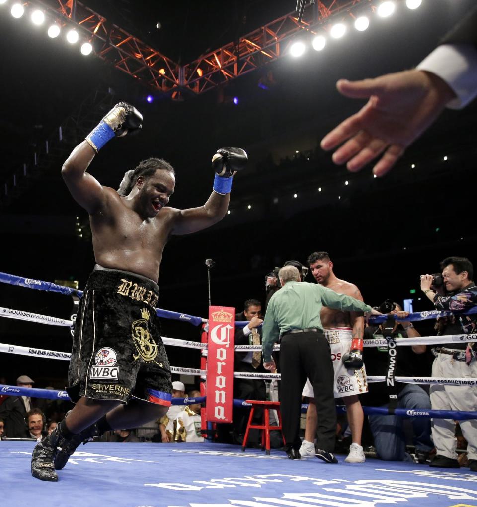 Bermane Stiverne celebrates after referee Jack Reiss stopped his fight against Chris Arreola during their rematch for the WBC heavyweight boxing title in Los Angeles, Saturday, May 10, 2014. Stiverne won the title. (AP Photo/Chris Carlson)