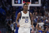 Dallas Mavericks forward Reggie Bullock (25) reacts after scoring against the Phoenix Suns during the second half of Game 3 of an NBA basketball second-round playoff series, Friday, May 6, 2022, in Dallas. (AP Photo/Tony Gutierrez)