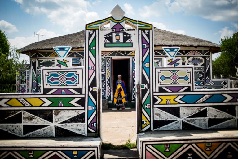 South African artist Esther Mahlangu, 81, whose colourful geometric works are exhibited around the world, stands outside her home in Mpumalanga