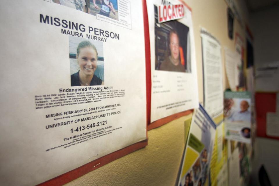 In this Tuesday Feb. 4, 2014 photo, a missing person poster of Maura Murray hangs in the lobby of the police station in Haverhill, N.H. Ten years ago, the Massachusetts college student drove off a road in a rural section of Haverhill in northern New Hampshire and hasn't been seen since. She left a tormented family, vexed investigators and a case rife with rumor and innuendo. (AP Photo/Jim Cole)