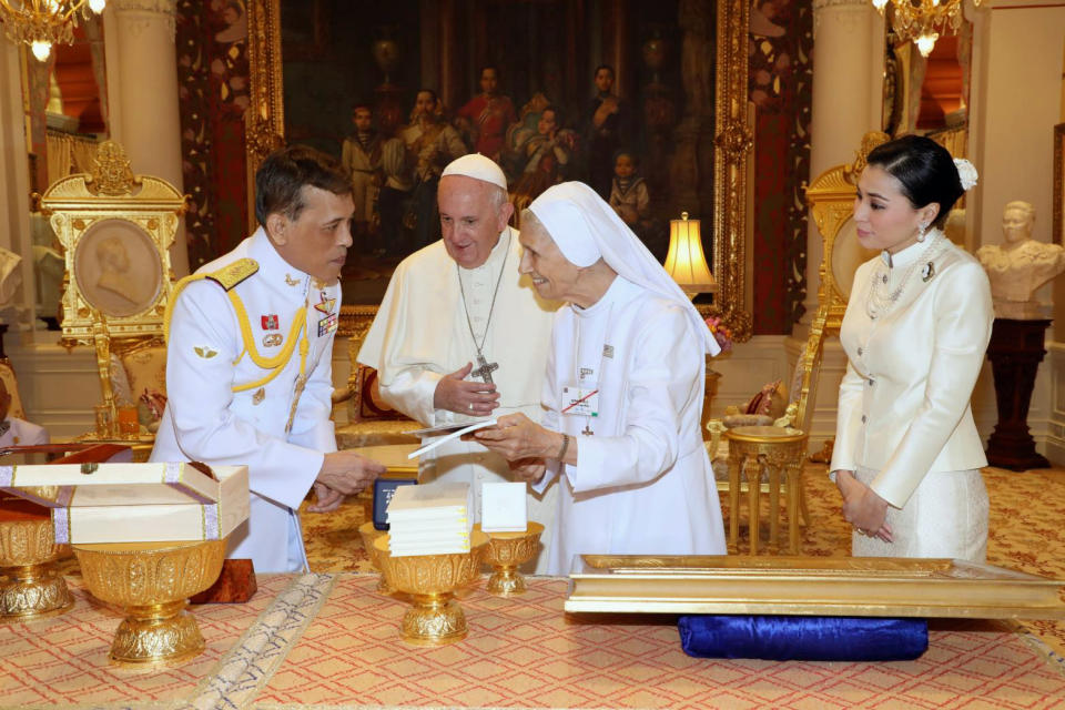 In this photo released by The Royal Household Bureau, Thai King Maha Vajiralongkorn talk to Pope Francis, his cousin Ana Rosa Sivori, and Thai Queen Suthida at Dusit Palace Thursday, Nov. 21, 2019, in Bangkok, Thailand. (The Royal Household Bureau via AP)