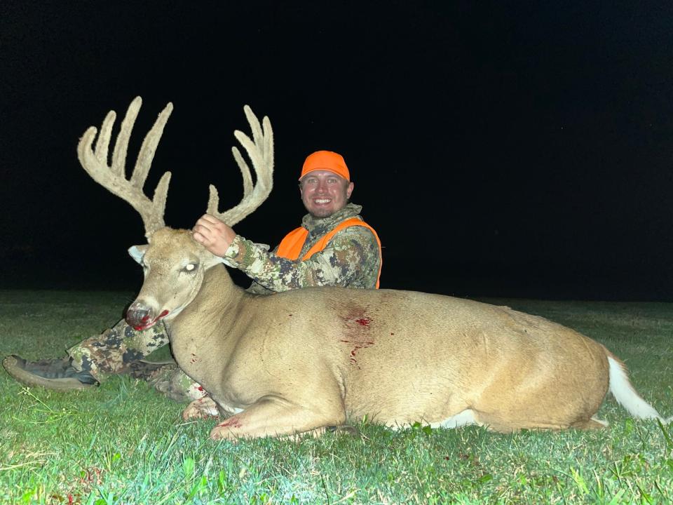 hunter poses with a big velvet Kansas whitetail buck