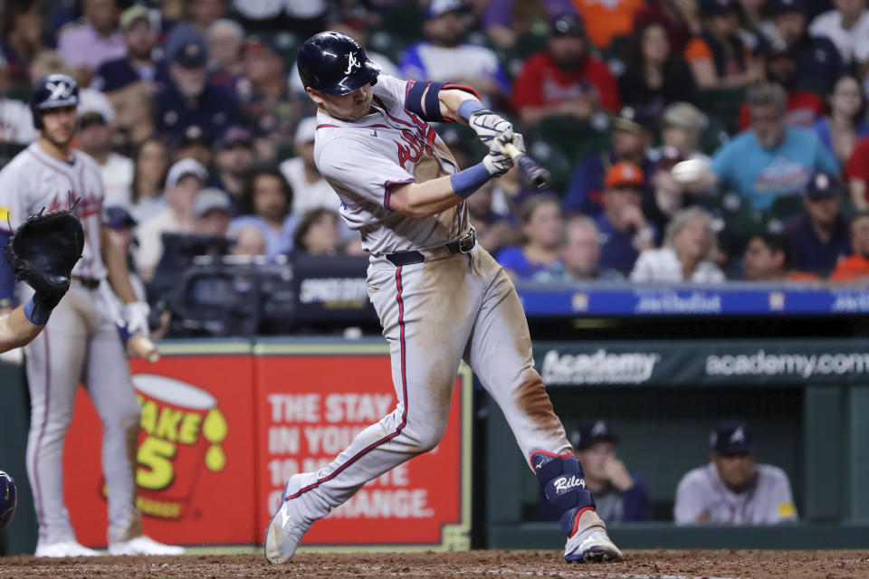 Atlanta Braves's Austin Riley hits an RBI single against the Houston Astros during the ninth inning of a baseball game Monday, April 15, 2024, in Houston. (AP Photo/Michael Wyke)