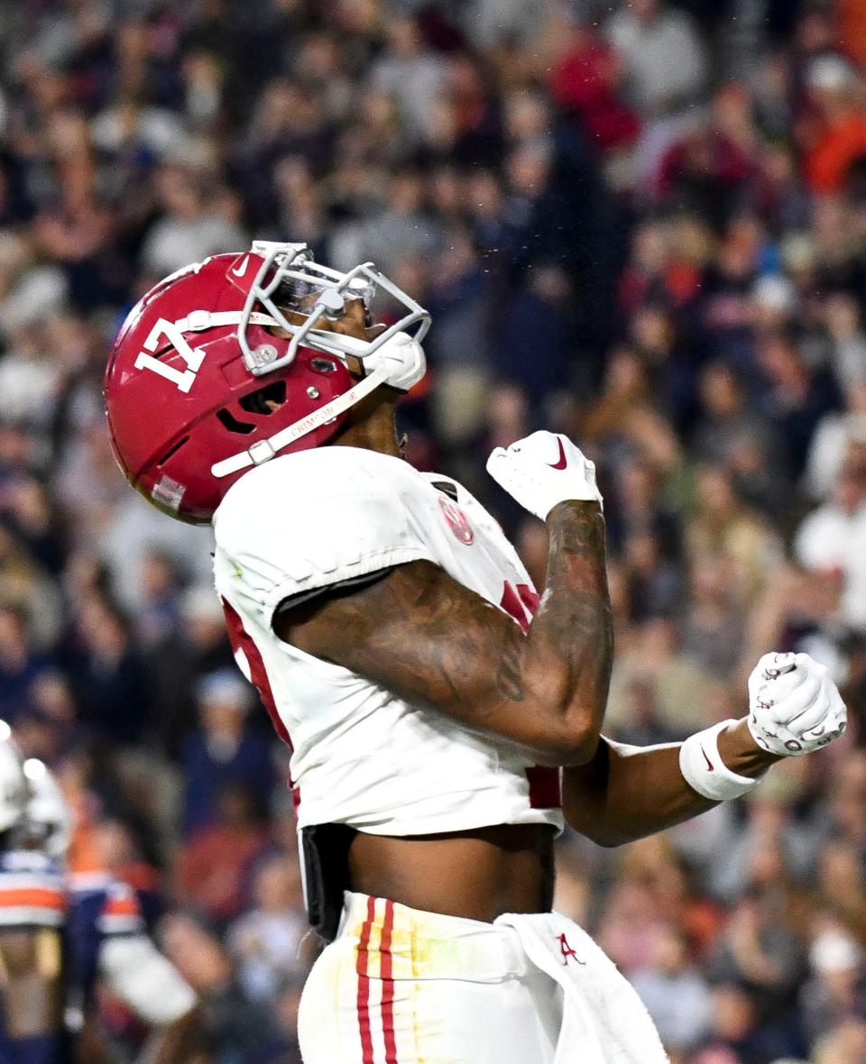 Nov 25, 2023; Auburn, Alabama, USA; Alabama Crimson Tide wide receiver Isaiah Bond (17) celebrates after catching a pass for a touchdown on 4th and 31 with under a minute to play at Jordan-Hare Stadium. Alabama defeated Auburn 27-24. Mandatory Credit: Gary Cosby Jr.-USA TODAY Sports