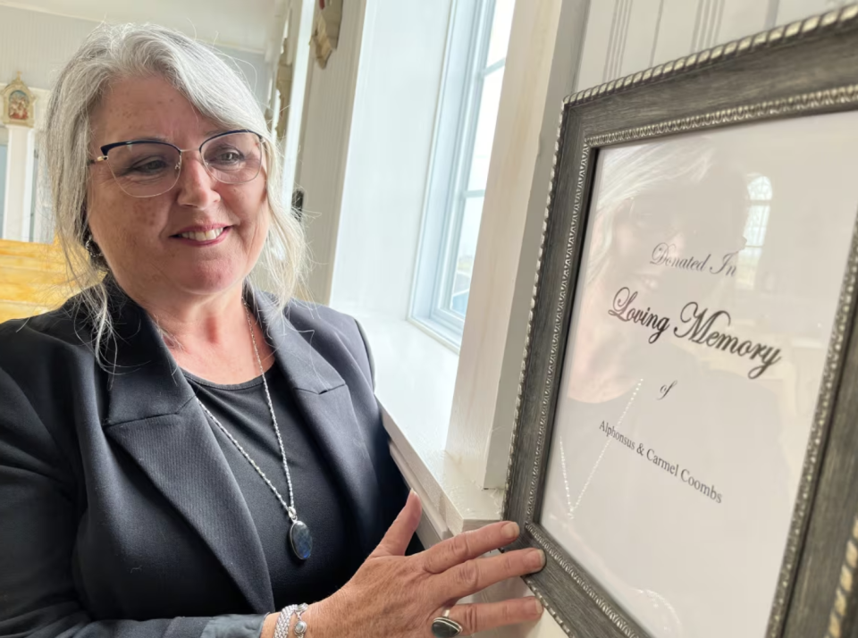 Cynthia Power donated one of the new windows at Holy Rosary church in Portugal Cove South in memory of her late parents, Alphonsus and Carmel Coombs. (Terry Roberts/CBC)