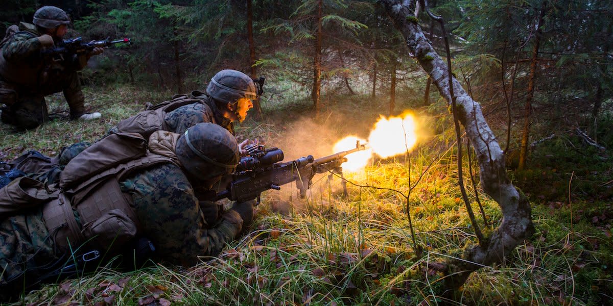 U.S. Marines Cpl Justin Droll and Lance Cpl. Stephen Luzier, Machine Gunners(0331), with E Company, 2nd Battalion, 2nd Marine Regiment, 2nd Marine Division, assault an enemy position during exercise Trident Juncture 18, Norway, Nov. 7, 2018.