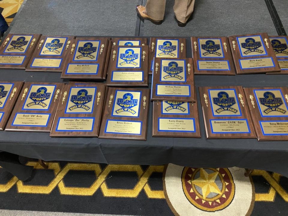 Each of the 21 athletes and coaches at the inaugural induction ceremony for E.E. Smith High School's Sports Hall of Fame received a custom plaque and golden jacket.