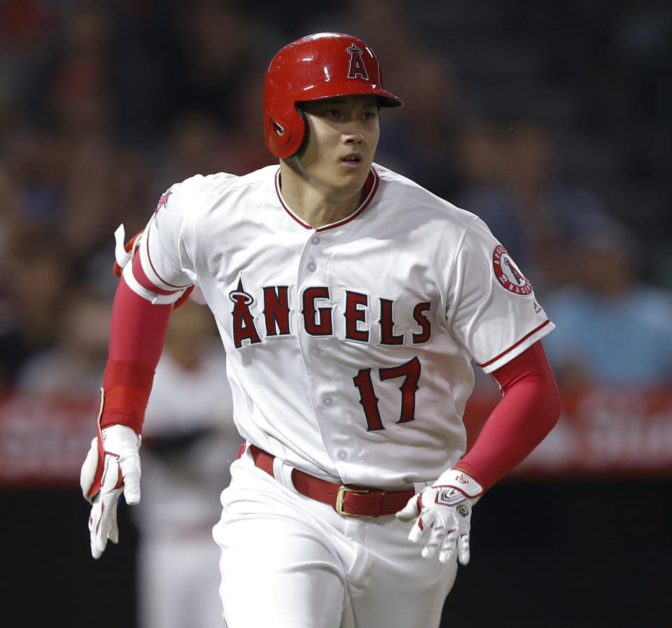 Los Angeles Angels designated hitter Shohei Ohtani runs out an RBI single to right against the Texas Rangers during the fourth inning of a baseball game in Anaheim, Calif., Wednesday, Sept. 26, 2018. (AP Photo/Alex Gallardo)