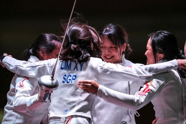 Singapore&#39;s women&#39;s epee team fencers celebrate winning gold at the Hanoi SEA Games. (PHOTO: SNOC/ Kelly Wong)