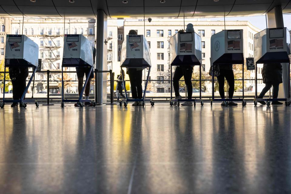 Voters cast their midterm election ballots at the Brooklyn Museum on November 8, 2022, in New York.