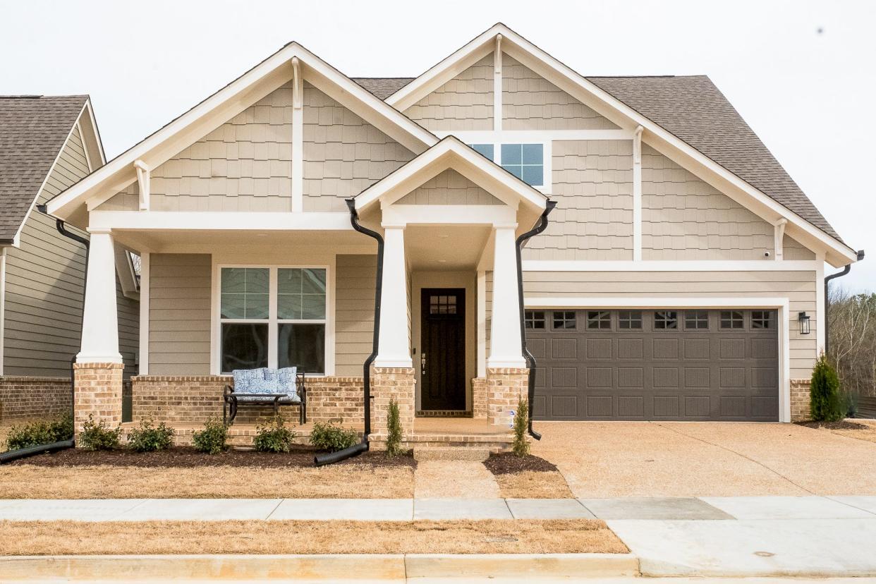 The Craftsman-style home has 1,700 square feet of living space, including 3 bedrooms and 2 baths.