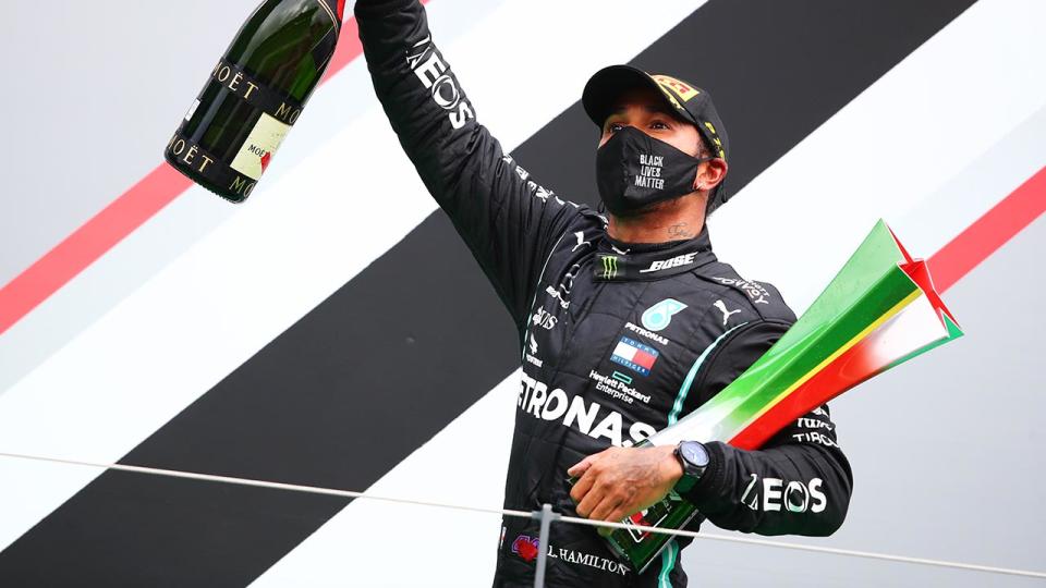 Lewis Hamilton, pictured here celebrating his record-breaking 92nd race win in Formula One.