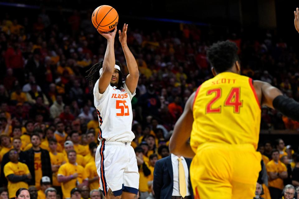 Illinois guard Skyy Clark (55) shoots a three point basket during the first half of an NCAA college basketball game against Maryland, Friday, Dec. 2, 2022, in College Park, Md.