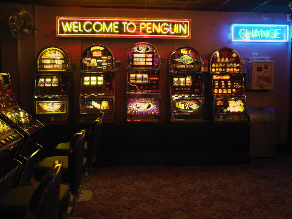 An empty casino with slot machines