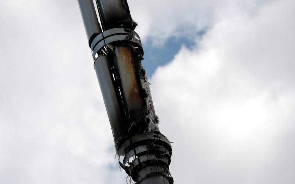 Telecom masts that enable the next generation of wireless communication have been set on fire in the UK this month. - Darren Staples /Bloomberg