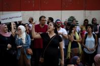 Demonstrators shout slogans during an anti-government protest outside the Central Bank of Lebanon in Beirut