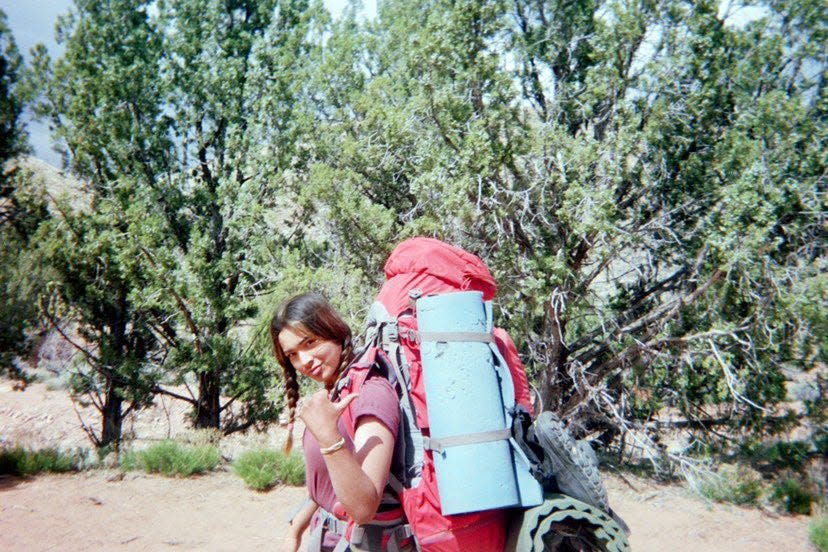 Katelyn with her 40-pound pack, hiking in the Utah desert.