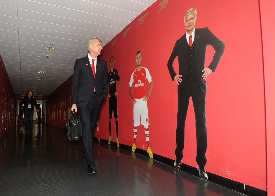 Arsene Wenger walks out of the stadium he practically built. (Getty)