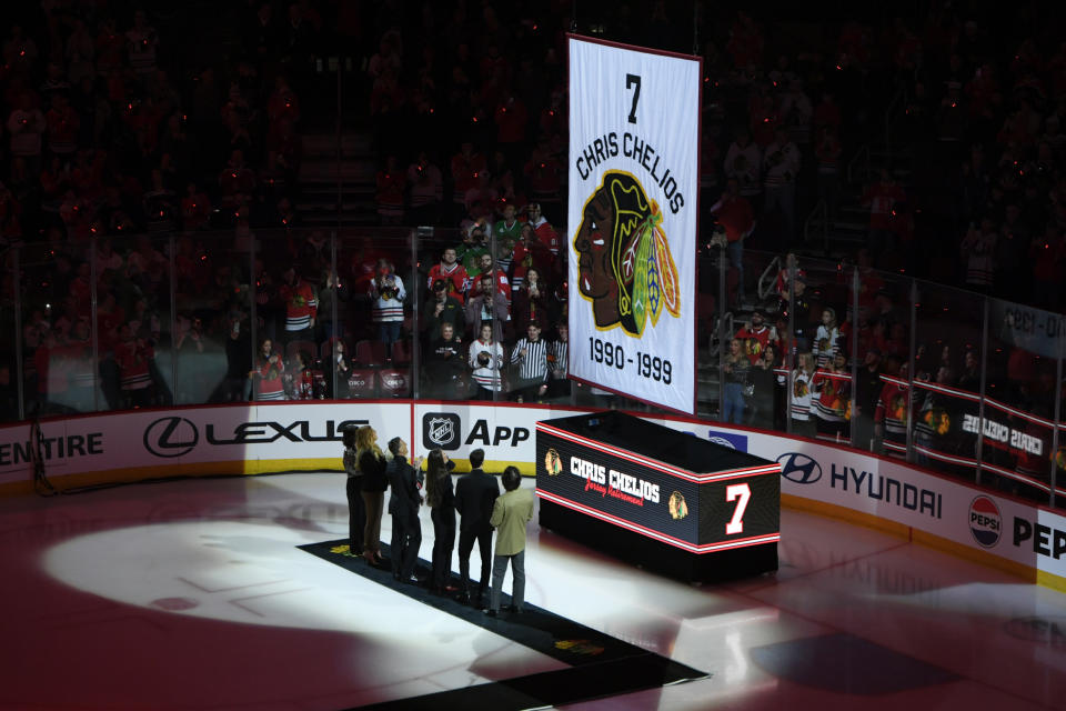 Former Chicago Blackhawks great Chris Chelios has his jersey retired during a ceremony before an NHL hockey game between the Chicago Blackhawks and Detroit Red Wings Sunday, Feb. 25, 2024, in Chicago. (AP Photo/Paul Beaty)