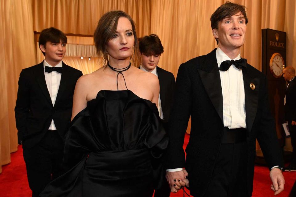 <p>VALERIE MACON/AFP via Getty </p> Cillian Murphy and his wife and sons arrive at the 2024 Oscars.