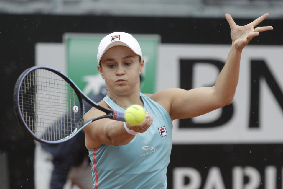 Australia's Ashleigh Barty returns the ball to United States' Cori Gauff during their quarter-final match at the Italian Open tennis tournament, in Rome, Friday, May 14, 2021. (AP Photo/Gregorio Borgia)