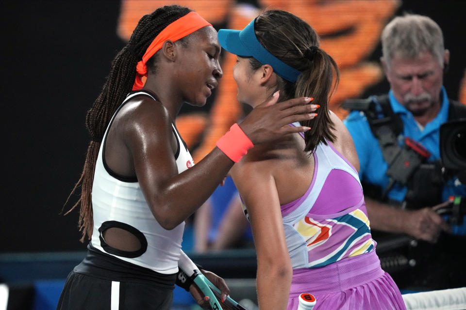 Coco Gauff, left, of the U.S. is congratulated by Emma Raducanu of Britain following their second round match at the Australian Open tennis championship in Melbourne, Australia, Wednesday, Jan. 18, 2023. (AP Photo/Dita Alangkara)