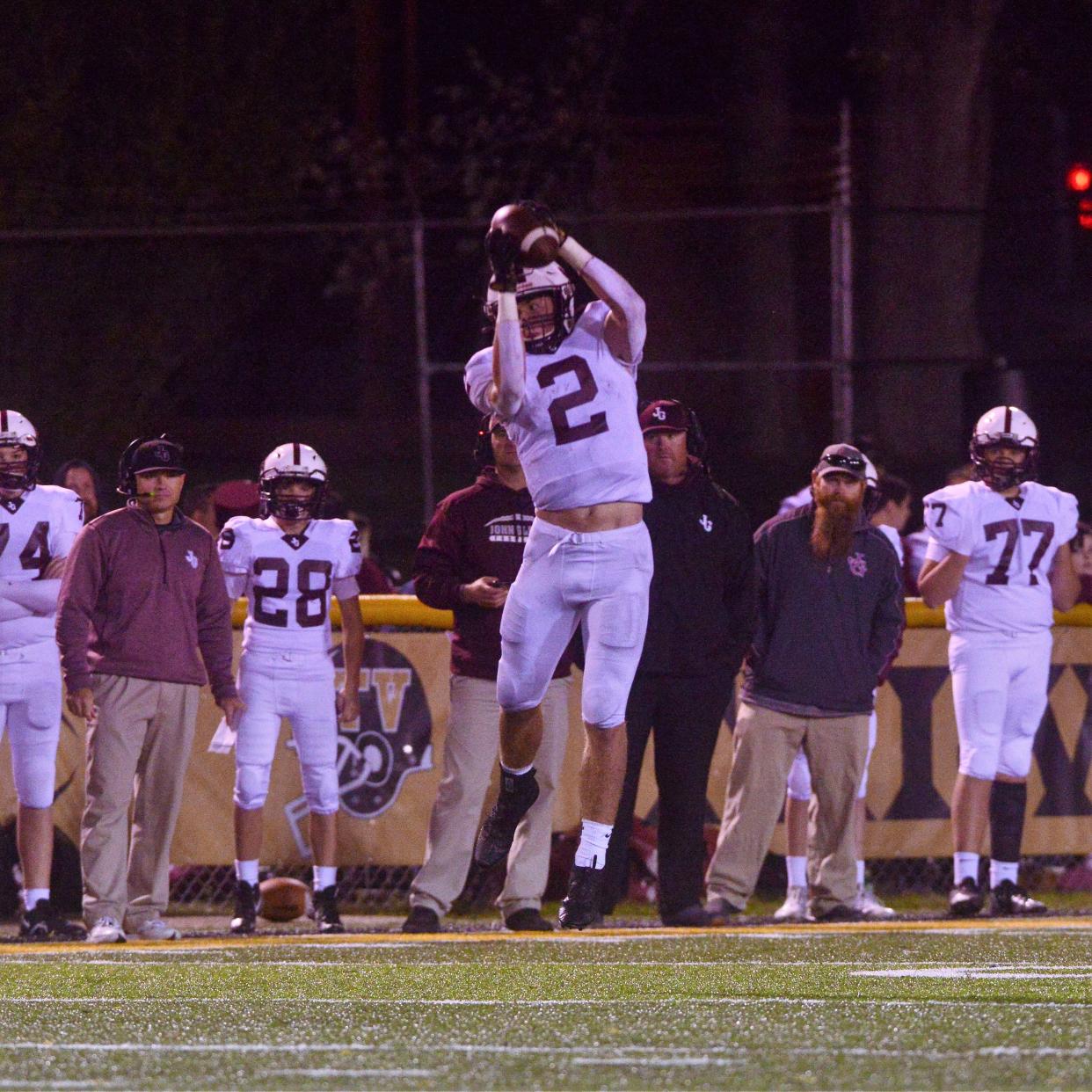 John Glenn's Colt Emerson makes a leaping catch against Tri-Valley on Friday night at Jack Anderson Stadium in Dresden. Emerson shared East District Division IV offensive player of the year honors with Meadowbrook's Josh Hupp and St. Clairsville's Avery Henry.