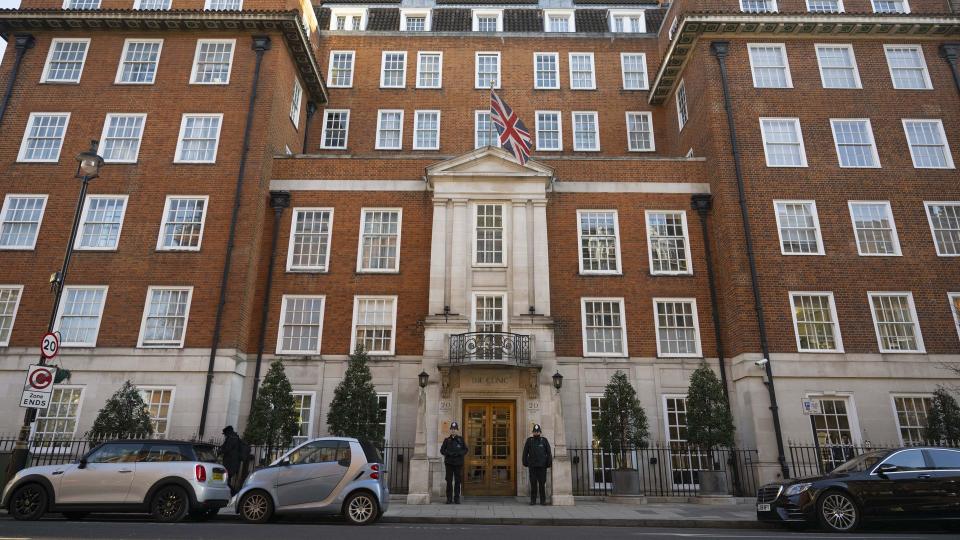 Police officers stand guard outside The London Clinic after Princess Kate underwent planned surgery