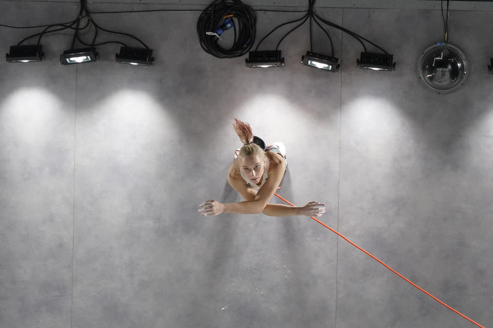 Janja Garnbret, of Slovenia, looks up at the wall prepares to climb during the lead qualification portion of the women's sport climbing competition at the 2020 Summer Olympics, Wednesday, Aug. 4, 2021, in Tokyo, Japan. (AP Photo/Jeff Roberson, POOL)